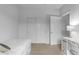 Bedroom with a twin bed, closet, and workspace at 44395 W Bailey Dr, Maricopa, AZ 85138
