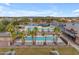 Community pool with palm trees and lounge area at 44395 W Bailey Dr, Maricopa, AZ 85138