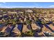 Aerial view of community, showing numerous homes and landscape at 44395 W Bailey Dr, Maricopa, AZ 85138