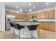 Modern kitchen with granite countertops and stainless steel appliances at 44395 W Bailey Dr, Maricopa, AZ 85138