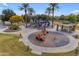 playground with play structures and shaded seating at 44395 W Bailey Dr, Maricopa, AZ 85138