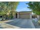 Single-story home with two-car garage and desert landscaping at 44395 W Bailey Dr, Maricopa, AZ 85138