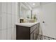 Stylish bathroom with dark vanity, gold fixtures, and checkered floor at 8728 E Via De Viva --, Scottsdale, AZ 85258