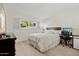 Bright bedroom with a queen-size bed, workspace, and ample closet space at 8728 E Via De Viva --, Scottsdale, AZ 85258