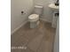 Clean powder room with pedestal sink and tile flooring at 25233 W Wayland Dr, Buckeye, AZ 85326