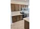 Modern kitchen with stainless steel appliances and stylish cabinetry at 25233 W Wayland Dr, Buckeye, AZ 85326