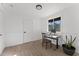 Bright home office features wood-look tile flooring, window with a view, and a workspace at 380 E Fletcher Ln, Wickenburg, AZ 85390