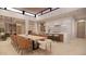 Modern kitchen with large island and wine storage at 10948 E Rising Sun Dr, Scottsdale, AZ 85262