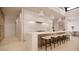 Modern kitchen with island, white cabinets, and wood accents at 10948 E Rising Sun Dr, Scottsdale, AZ 85262