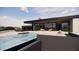 Inviting infinity pool with a luxurious outdoor living space at 10948 E Rising Sun Dr, Scottsdale, AZ 85262
