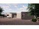 Contemporary home exterior with desert landscaping at 10948 E Rising Sun Dr, Scottsdale, AZ 85262
