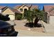 Two-story house with a landscaped yard, driveway, and palm trees at 2474 E Westchester Dr, Chandler, AZ 85249