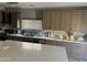 Modern kitchen with island and wood cabinets at 2474 E Westchester Dr, Chandler, AZ 85249