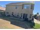 Large backyard with patio, grass and AC units at 2474 E Westchester Dr, Chandler, AZ 85249