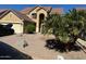 Two-story house with a tan exterior, two-car garage, and desert landscaping at 2474 E Westchester Dr, Chandler, AZ 85249