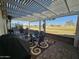 Covered patio with seating area, pergola, and golf course view at 650 N Hawes Rd # 2729, Mesa, AZ 85207