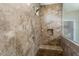 Tiled shower with built-in seat and glass enclosure at 26304 W Tina Ln, Buckeye, AZ 85396