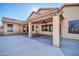 Covered patio with ceiling fan, adjacent to house at 12430 W Virginia Ave, Avondale, AZ 85392