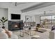 Bright living room with a fireplace, large windows, and comfortable seating at 3800 E Lincoln Dr # 42, Phoenix, AZ 85018