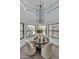 Elegant dining area featuring a round table, chandelier, and views at 3800 E Lincoln Dr # 42, Phoenix, AZ 85018