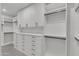 Large walk-in closet with ample shelving and drawers at 3800 E Lincoln Dr # 42, Phoenix, AZ 85018