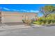 Single-story home with a light-colored exterior and landscaped yard at 3800 E Lincoln Dr # 42, Phoenix, AZ 85018