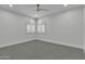 Spacious bedroom with grey carpet and arched windows at 3800 E Lincoln Dr # 42, Phoenix, AZ 85018