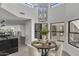Bright dining area with round table and seating for four at 3800 E Lincoln Dr # 42, Phoenix, AZ 85018
