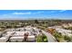 Aerial view of community with city views, tennis court, and swimming pool at 3800 E Lincoln Dr # 42, Phoenix, AZ 85018