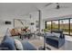 Spacious living room with ample natural light and modern furniture at 3800 E Lincoln Dr # 42, Phoenix, AZ 85018
