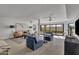 Open living area with modern furniture and access to backyard at 3800 E Lincoln Dr # 42, Phoenix, AZ 85018