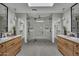 Spa-like bathroom with a large walk-in shower and dual vanities at 3800 E Lincoln Dr # 42, Phoenix, AZ 85018
