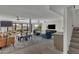 Open living area with modern furniture and access to backyard at 3800 E Lincoln Dr # 42, Phoenix, AZ 85018