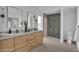 Modern bathroom with double vanity, large mirror, and hexagon tile shower at 3800 E Lincoln Dr # 42, Phoenix, AZ 85018