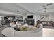 Spacious living room with a curved sectional sofa and fireplace at 3800 E Lincoln Dr # 42, Phoenix, AZ 85018