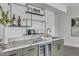 Stylish wet bar with marble countertops, wine storage, and modern shelving at 3800 E Lincoln Dr # 42, Phoenix, AZ 85018