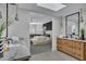 Modern bathroom with marble countertops and a view of the bedroom at 3800 E Lincoln Dr # 42, Phoenix, AZ 85018