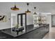 Contemporary kitchen with large island and pendant lighting at 3800 E Lincoln Dr # 42, Phoenix, AZ 85018