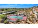 Community tennis court with gazebo and surrounding landscape at 3800 E Lincoln Dr # 42, Phoenix, AZ 85018