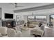 Living room with sectional sofa, fireplace, and stunning views at 3800 E Lincoln Dr # 42, Phoenix, AZ 85018