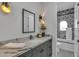 Stylish bathroom with marble countertop and patterned tile at 3800 E Lincoln Dr # 42, Phoenix, AZ 85018
