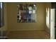 Bright dining room with tile flooring and a window overlooking a patio at 3955 N 294Th Ln, Buckeye, AZ 85396