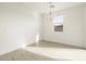 Dining area with tile floors and modern chandelier at 33 S 176Th Dr, Goodyear, AZ 85338