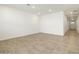 Spacious, open living area with tiled flooring and recessed lighting at 33 S 176Th Dr, Goodyear, AZ 85338