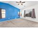 Main bedroom with vaulted ceiling, carpet, and large windows at 13029 W Campbell Ave, Litchfield Park, AZ 85340