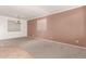 Bright dining room with neutral carpeting and walls at 13029 W Campbell Ave, Litchfield Park, AZ 85340