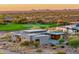 Aerial view showcasing a home's modern architecture and stunning desert landscape at 2866 S Petroglyph Trl, Gold Canyon, AZ 85118