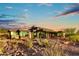 Modern home with large windows, stone exterior, and stunning views at 2866 S Petroglyph Trl, Gold Canyon, AZ 85118