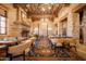 Upscale dining room with ornate fireplace and rich color palette at 2866 S Petroglyph Trl, Gold Canyon, AZ 85118