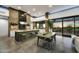 Modern kitchen with an island, green lower cabinets, and wood countertops at 2866 S Petroglyph Trl, Gold Canyon, AZ 85118